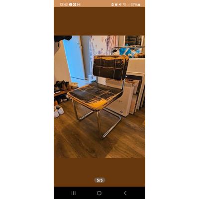 Vier eetkamerstoelen met leer