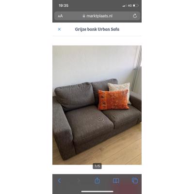 Grijze 2-zits bank in goede staat 