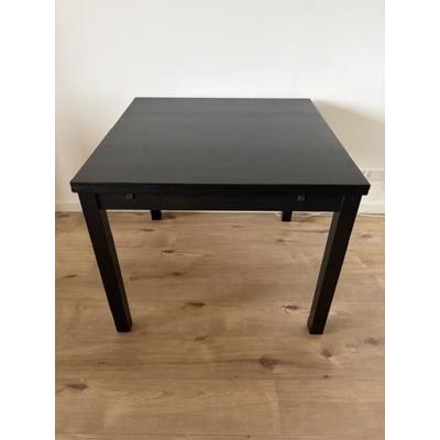 donkerbruine/zwarte uitschijfbare eettafel