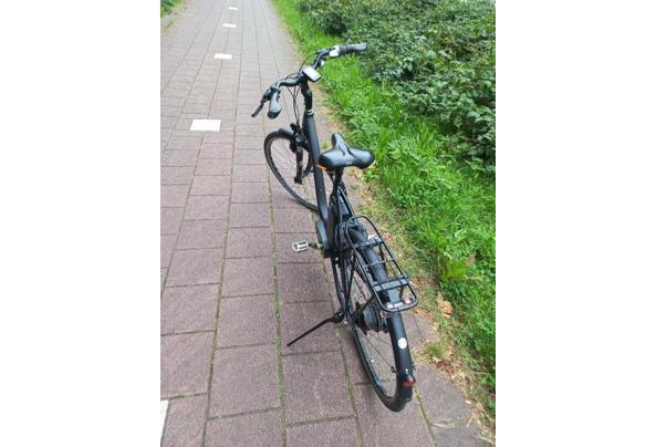 Elektrische damesfiets in prima staat, inclusief accu en oplader. - Achterkant-2
