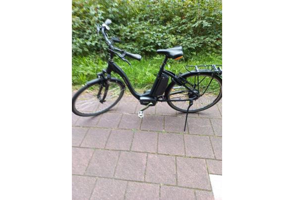 Elektrische damesfiets in prima staat, inclusief accu en oplader. - Voorkant-1