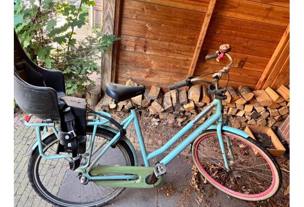 Gazelle fiets met kinderzitje - 94374700-6264-4d97-a89f-c26820794513