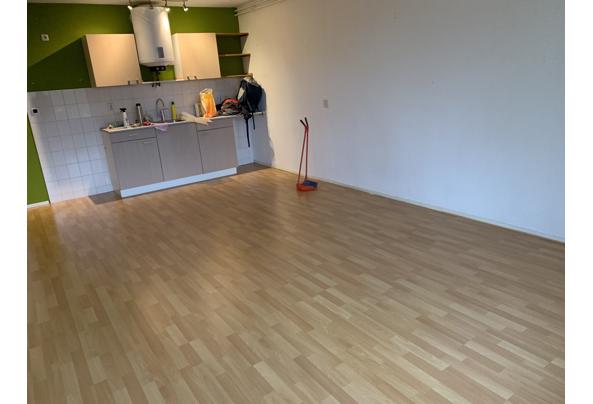 Laminaatvloer beuken 60 m2 plus een nieuw pak en plinten - IMG_6173