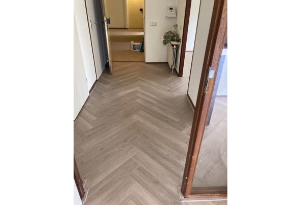 Visgraatlaminaat in zeer goede staat. ca. 70 m2; zelf eruit halen. - 5F01F879-3F07-4DC0-8755-1E2377219A22