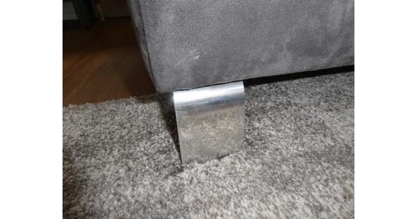 Grijze hoekbank met stoffen bekleding