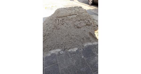 Zand en stoeptegels