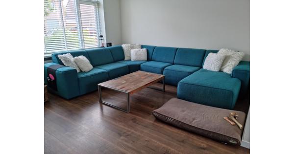 Groot turquoise stoffen bankstel, u-vorm