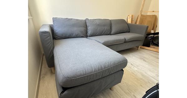 Grijze bank met chaise longue (3-zits)